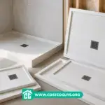 Foam Shower Pans in multiple standard sizes beside an installed shower base during bathroom renovation