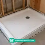 Standard Shower Pan Size shown with a white shower pan in an unfinished bathroom refit