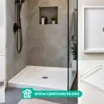 White 30 x 36 shower pan with center drain set on bathroom subfloor before wall installation