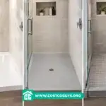 Three shower pans compared: white acrylic, gray solid surface, and small-format tileable pan